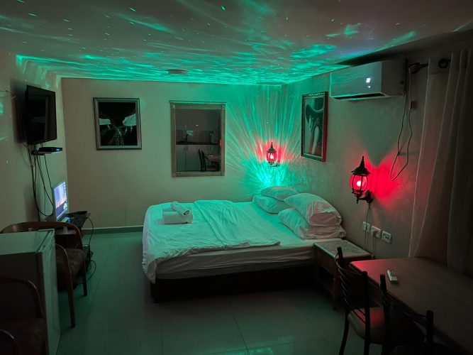 Romantic boutique hotel suite with a large double bed in Jerusalem